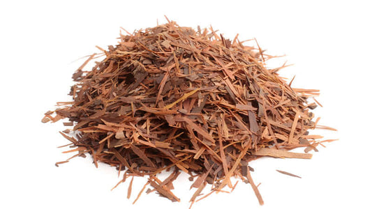 Clavo Huasca herb in a pile, showcasing its dried wood shavings and natural textures.