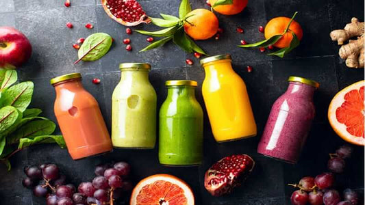 Colorful assortment of smoothies and juices featuring superfoods for optimal nutrition and health.