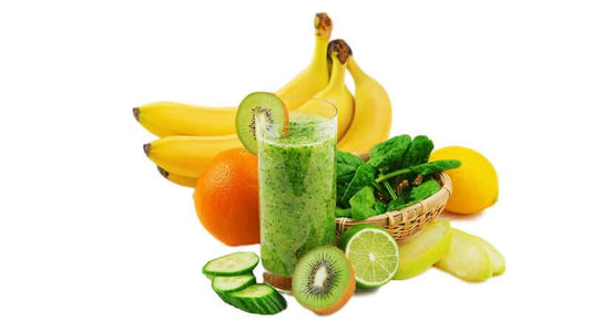 A refreshing green smoothie surrounded by fresh fruits and vegetables highlighting phytochemicals.