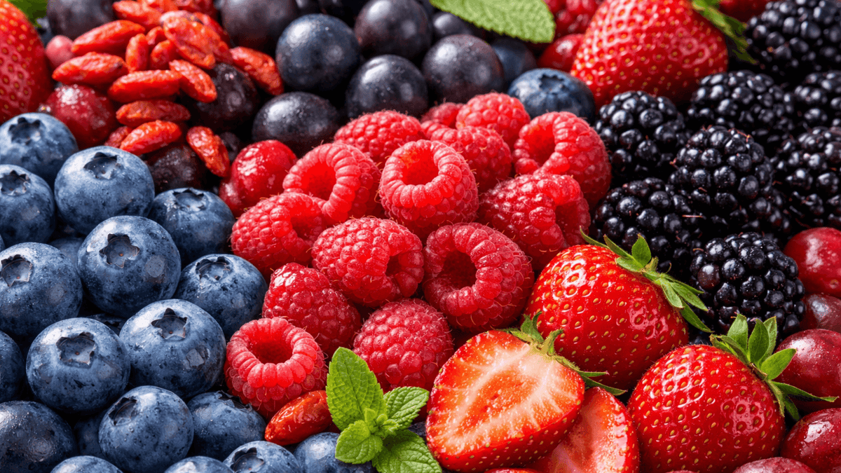 A colorful assortment of the healthiest berries including blueberries, raspberries, strawberries, and blackberries.