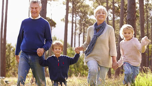 Glutathione in Human Disease, Family enjoying a walk outdoors, representing connection and health amidst nature.