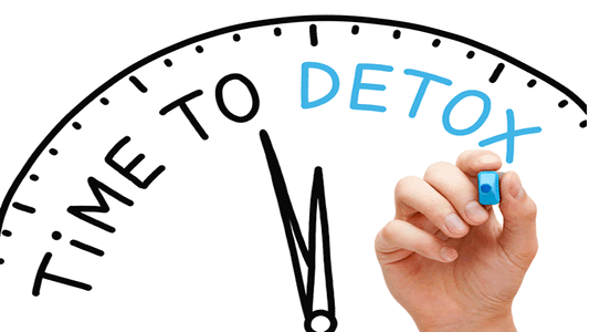 Time to detox clock illustration with hand and blue marker writing detox.