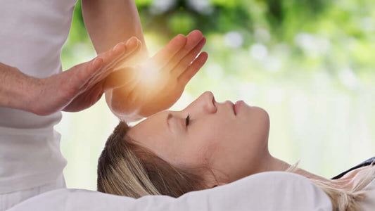 Energy Healing by Marelon Bjorkaes session focusing on a woman receiving healing energy.