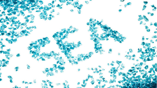 Chelated Minerals represented by blue crystals on white background, showcasing their vibrant appearance.