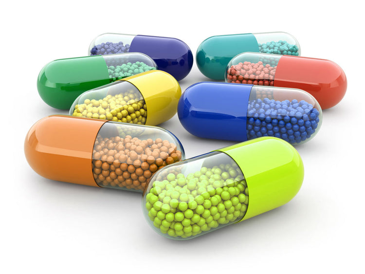 Colorful capsules filled with minerals, representing Highly Absorbable Single Elements for wellness.