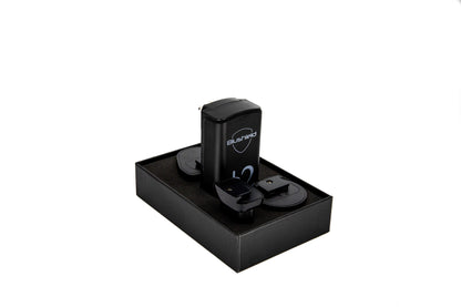 Phi Φ 2 Plugin device for EMF Protection for Small Homes, resting in a sleek black packaging.
