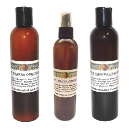 Three brown bottles of Crown Chakra ORMUS Ormus Oils Lotion, Spray and Oil with white labels on a white background