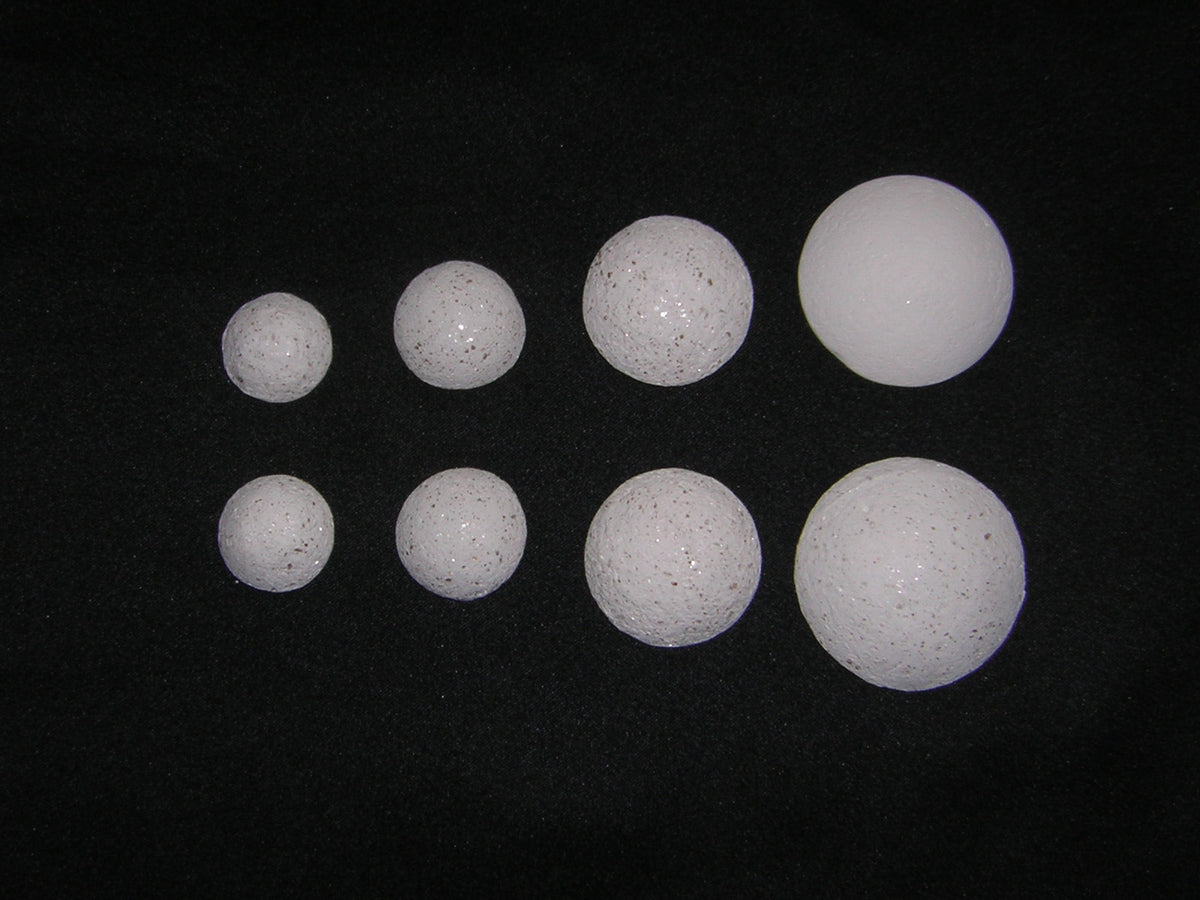 Crystal Pearls Sparkly – a collection of various sizes of sparkly white crystal spheres on a black background.